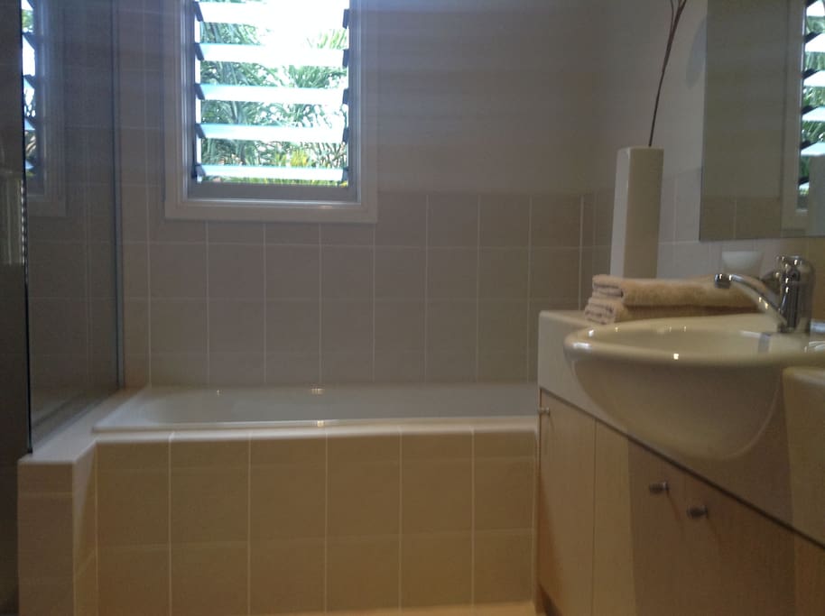 Private bathroom with tub and separate large shower
