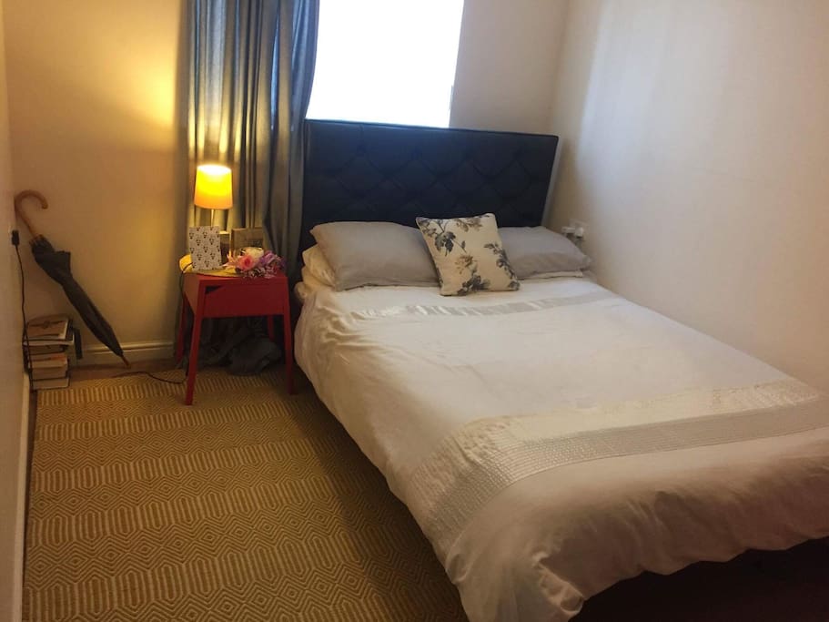 Double bed with memory foam topper. Built in wardrobes.