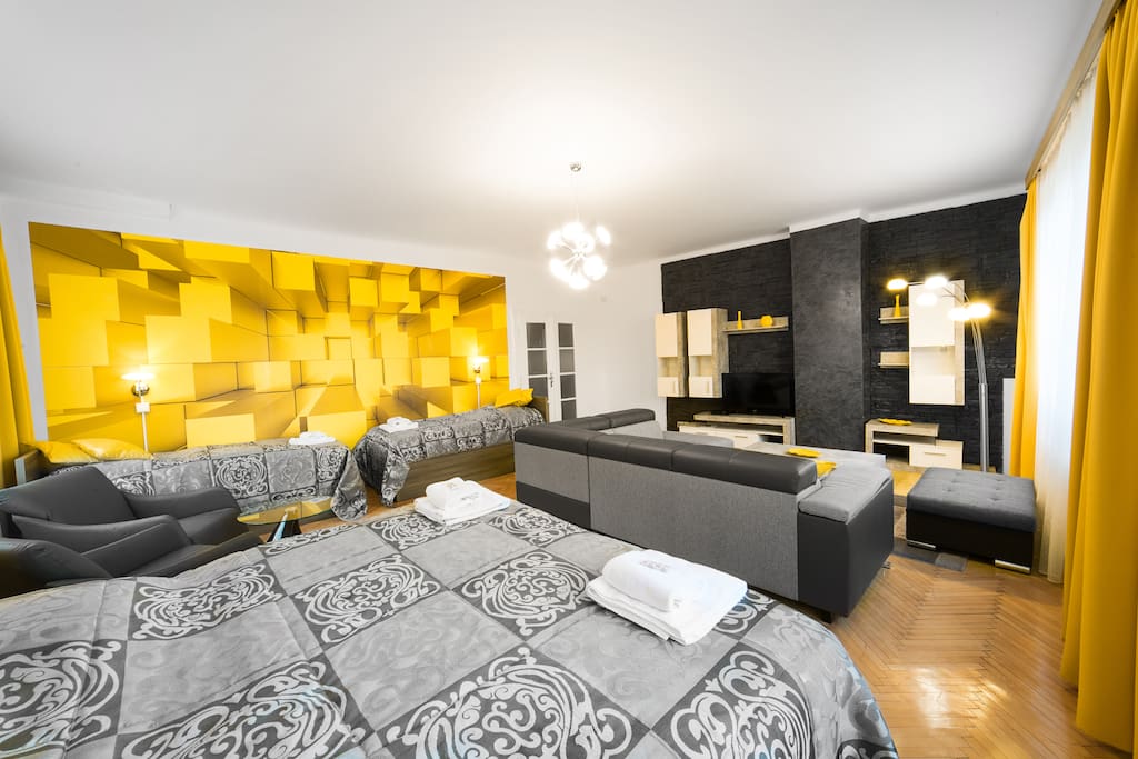 1st room (in one part there is living corner and in second part there is double bed and 2 single beds as a 1st bedroom)