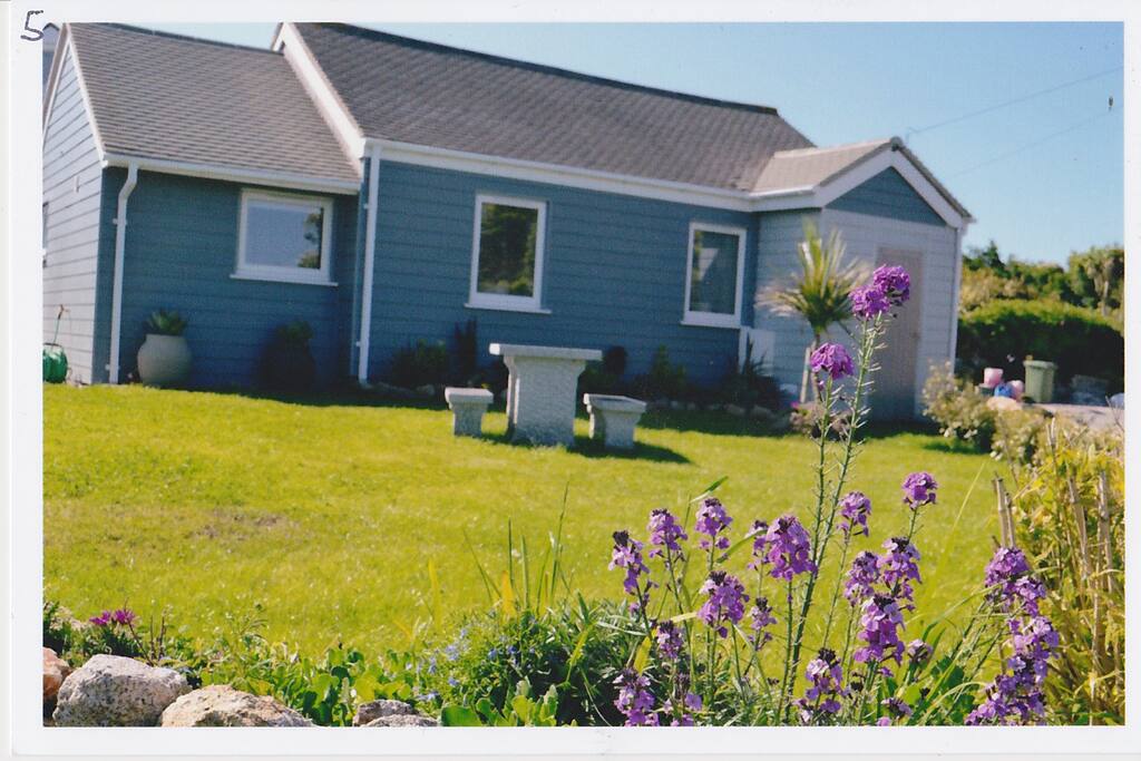 This shows the front of the property with the sea behind the photographer.