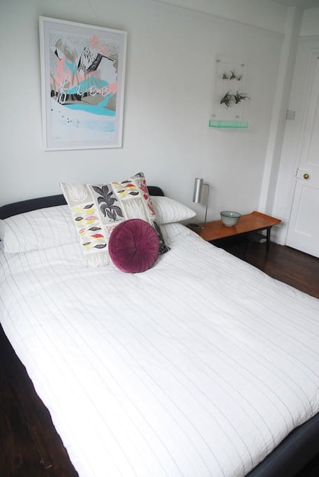 A comfy double bed awaits.