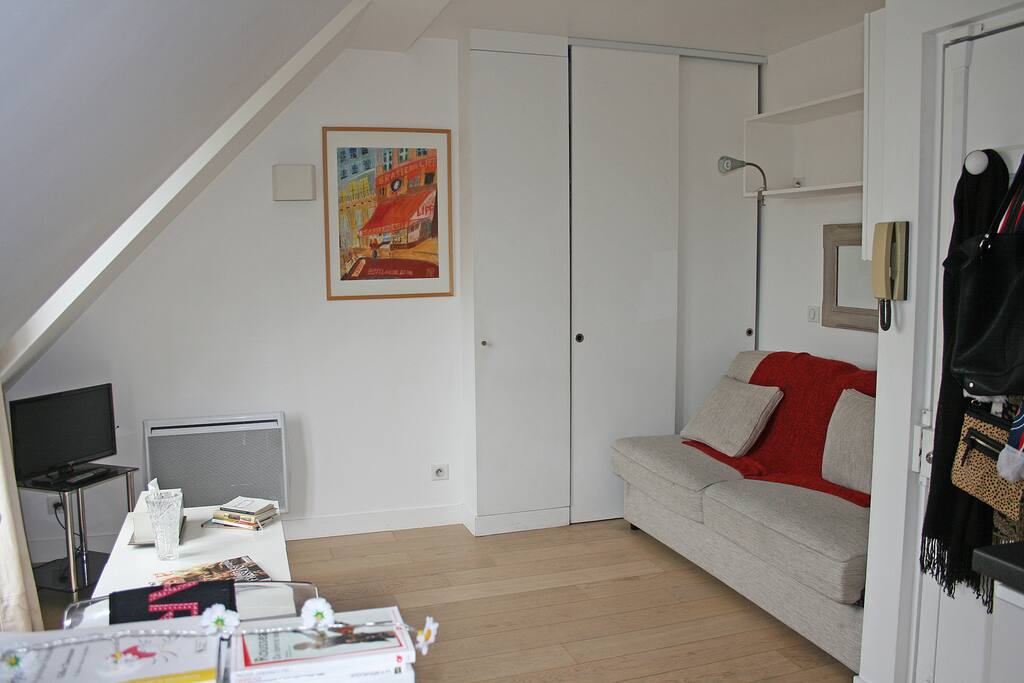 Towards the sofa and the cupboard