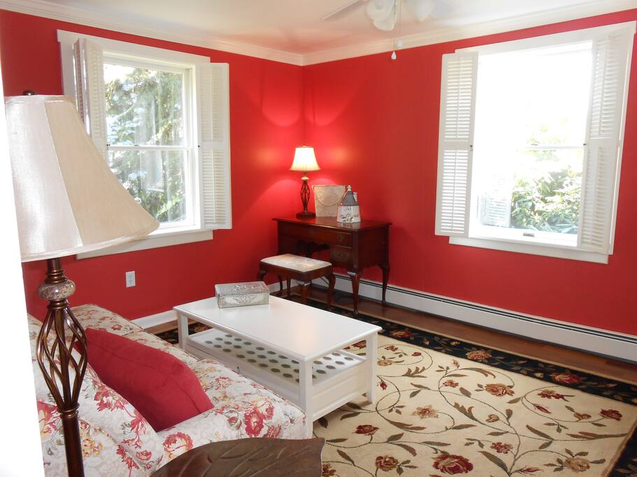 The living room is bright with great farm views