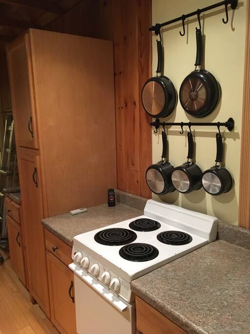 Galley kitchen with cooking facilities.