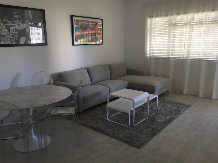 living room leading into NW facing balcony, smart tv