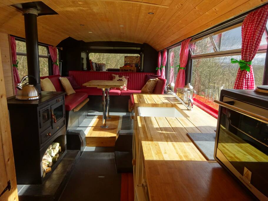 The wood stove warms the dining area which can also be used as an extra double bedroom.