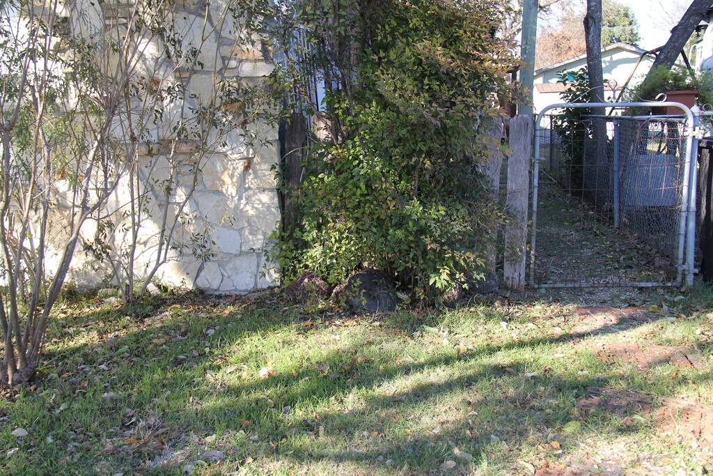 Entrance gate leading to back house (which you will enter)