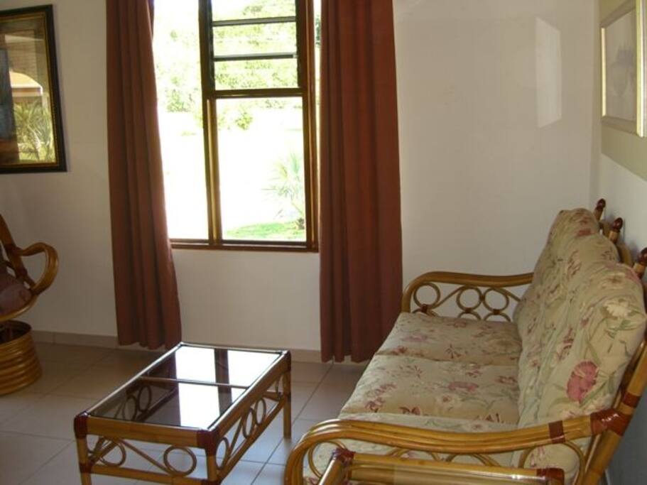 Beautiful hardwood ceilings and doors grace the living room