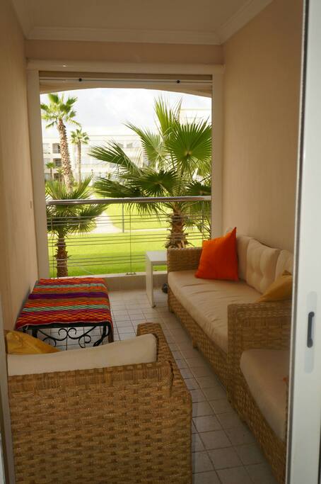 Furnished terrace overlooking landscaped gardens and pool