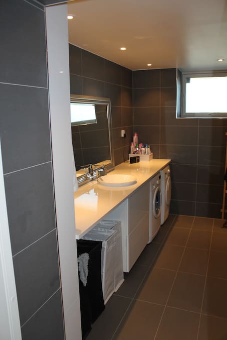 Bathroom with washing machine and dryer (shared with host)