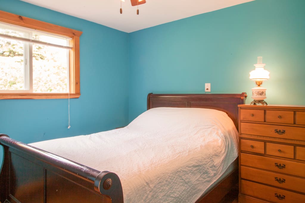 Bedroom number 2. Comfortable queen sized bed, ceiling fan.