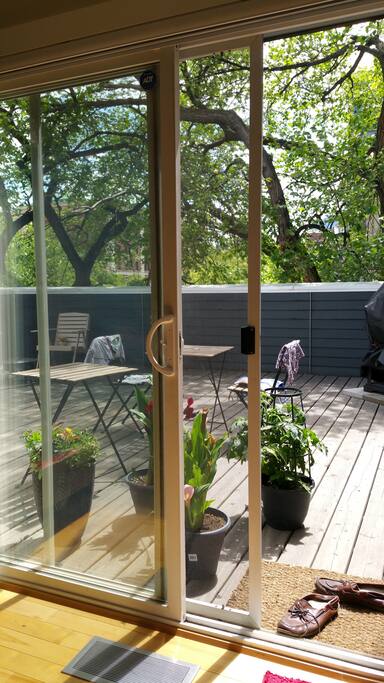 Larger of the two private roof patios in the summer (~400 sq feet!) Sliding glass door off of master bedroom