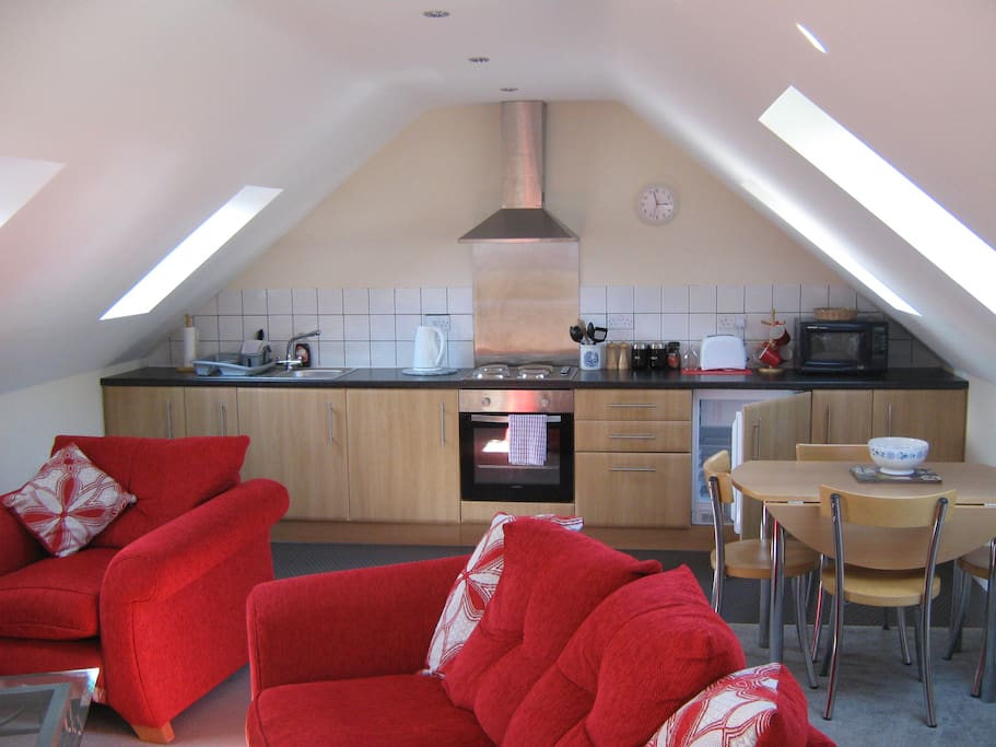 Main lounge with kitchen diner at rear.