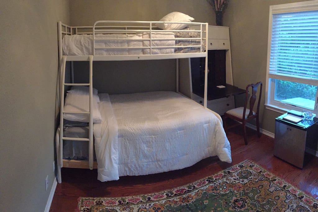 Second bedroom with full and twin bunks and desk.