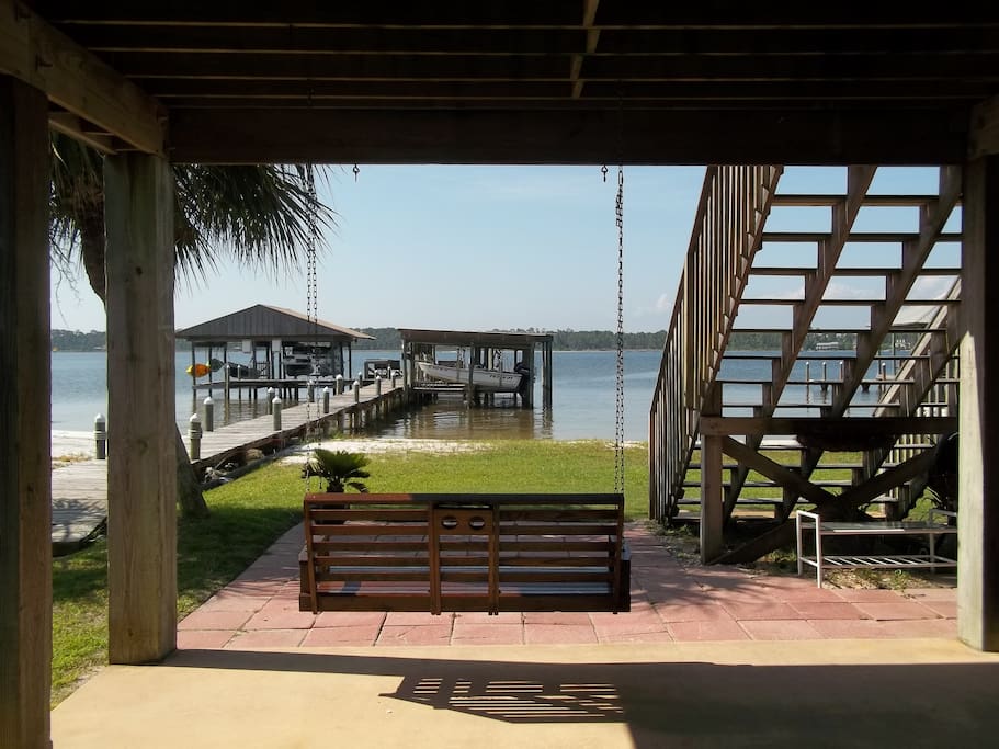 Enjoy the swing as you watch the activity on Little Lagoon. Grass and sand between house and water for you to enjoy.