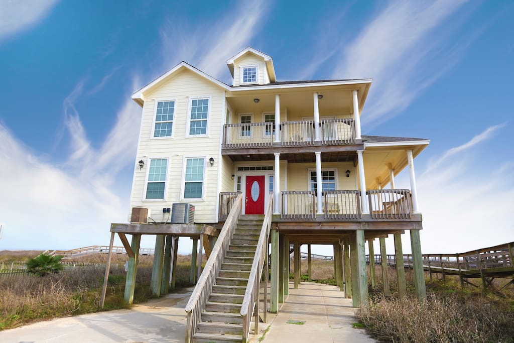 Front of the house. Lots of deck space and covered porches. Ocean is directly behind.