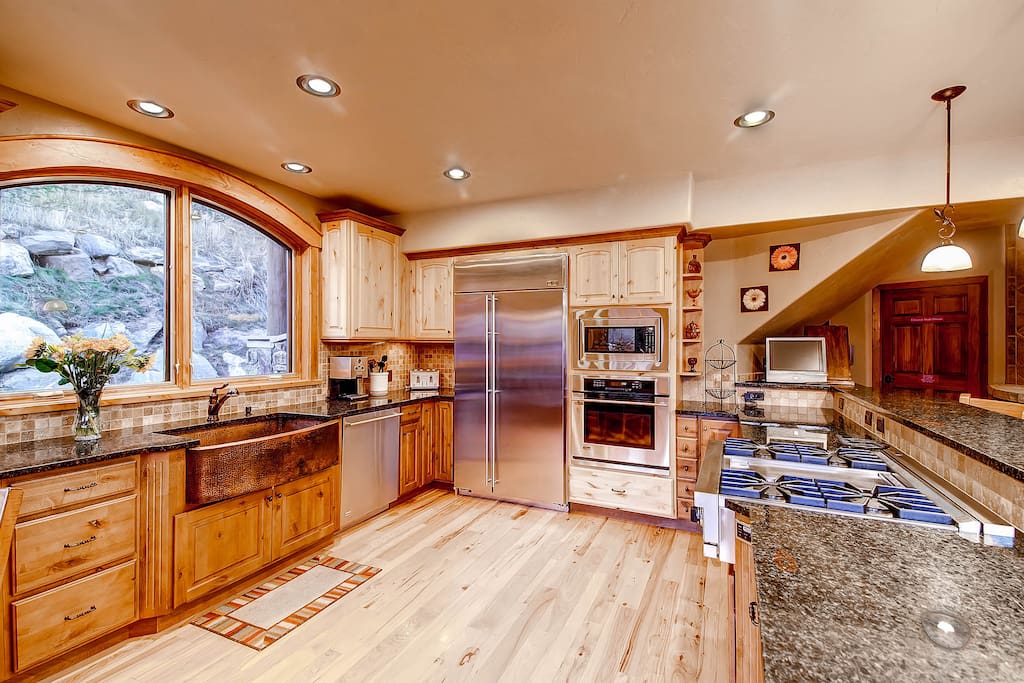 Spacious Kitchen with gas cooktop and bar seating