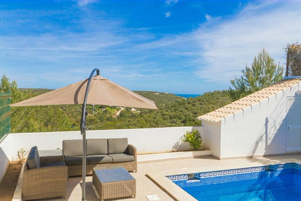 Poolside sitting area and sea view