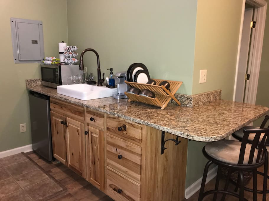 Granite counters, farm sink, microwave, Keurig Coffee maker, with a variety of types to choose from. Snacks also provided.