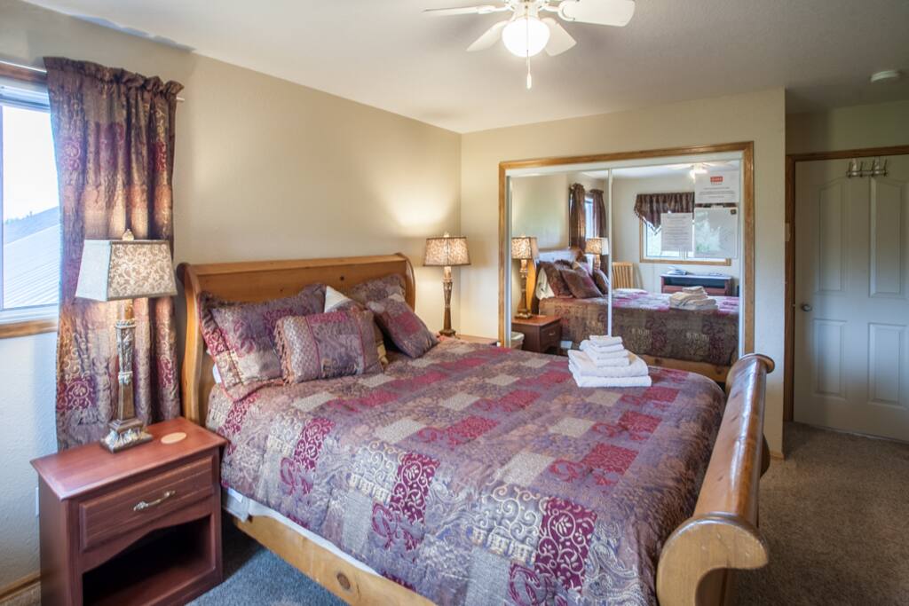 Extra pillows, blankets and room to hang up your personal items are in the mirrored closet.