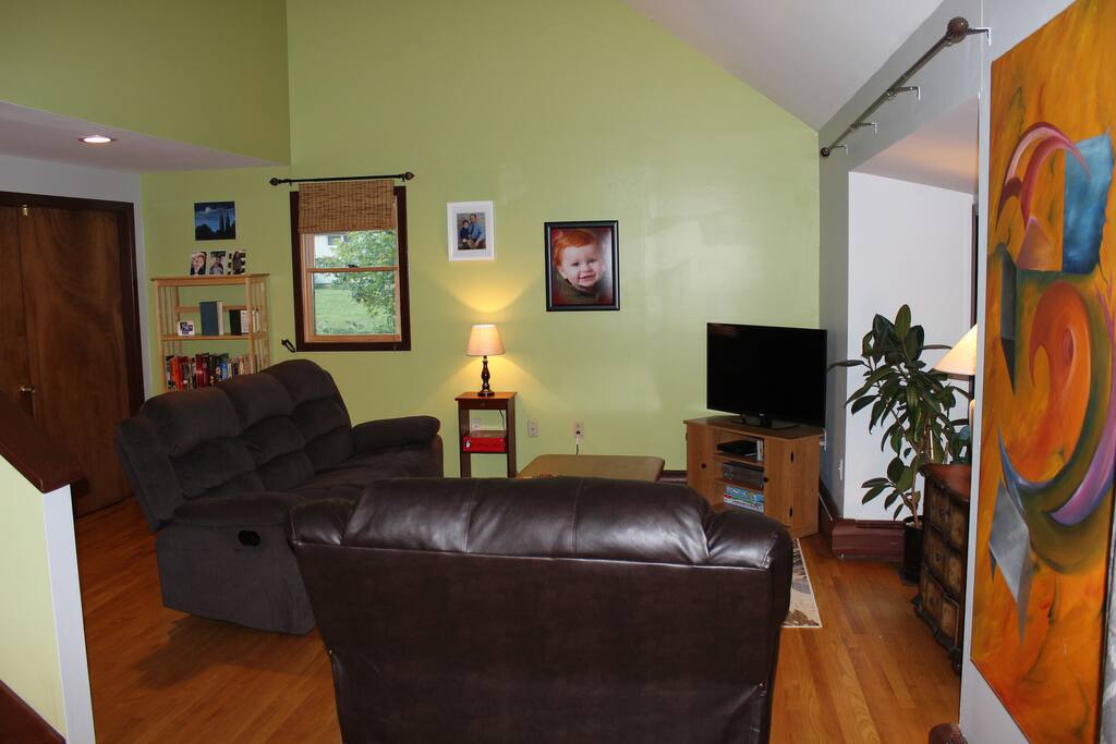 Living room space is open to guests. Bright and sunny room with vaulted ceilings. Walk out to screen house on deck.