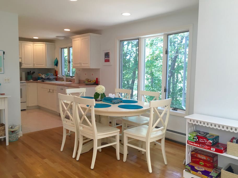 Breakfast/dinner table in front of kitchen with views of the river