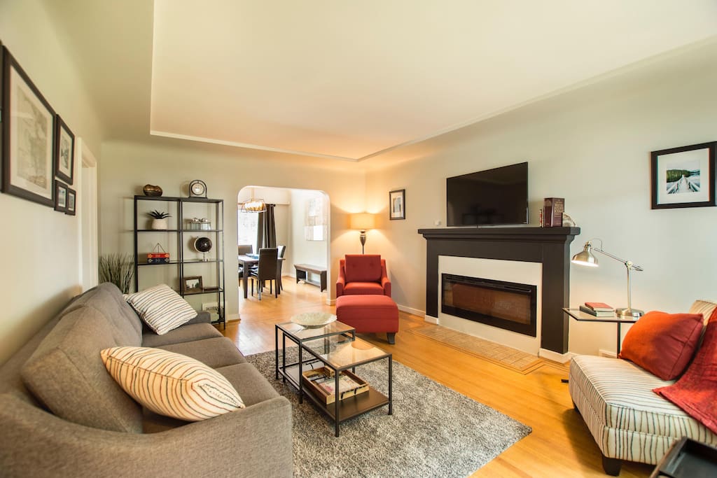 Living Room with queen pullout safe bed, 50" TV & Dining Room