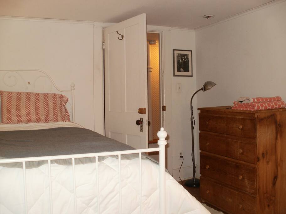 This guest room shares a bathroom with one other person.