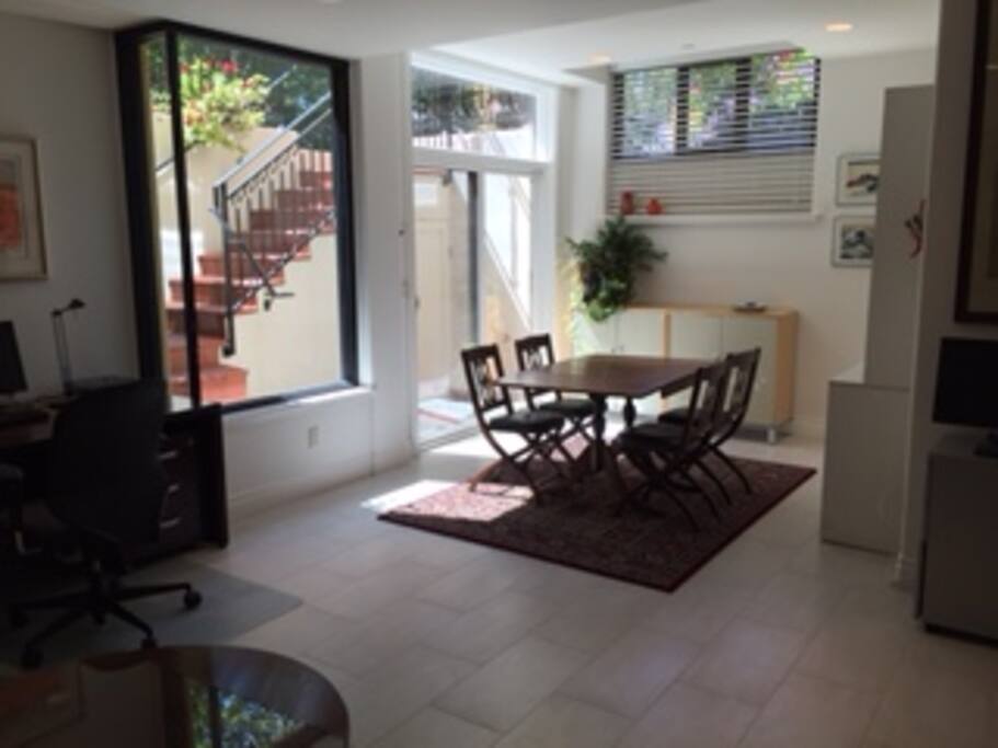 Entrance to the suite dining table; to the left office desk
