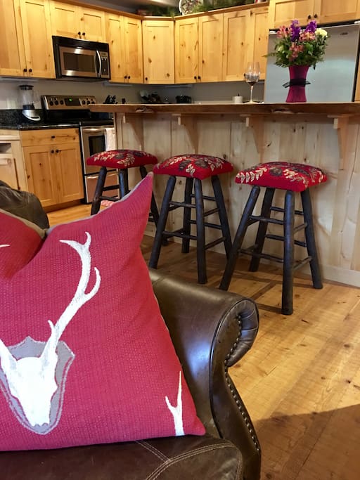 Beautiful kitchen with rustic bar and stools