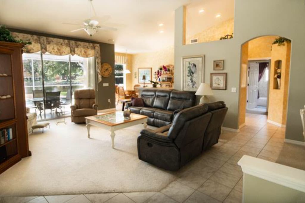 Great room with pool and lake view