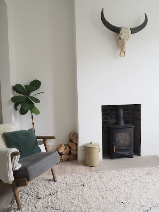 Bright, cosy lounge with log burner