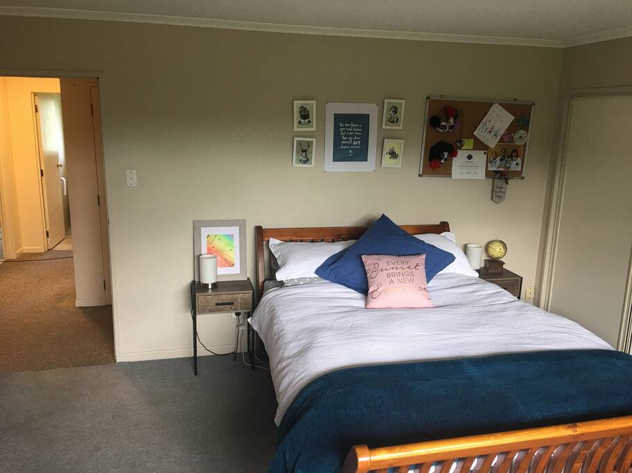Large double bedroom with queen bed, wardrobe, coffee/tea making facilities, bathroom and toilet exclusive to guests (seen to the left of this picture.