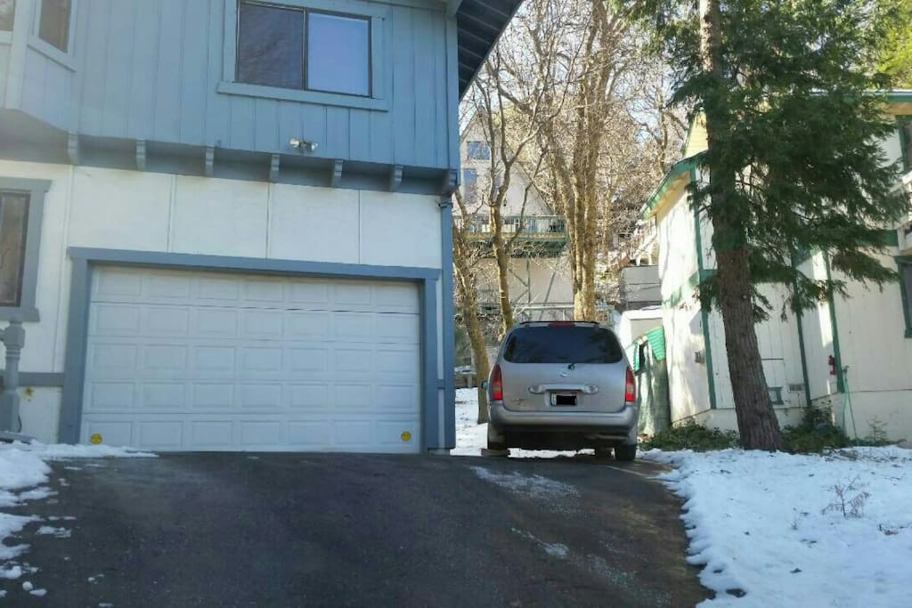 Garage and extra parking spaces on the side of the house