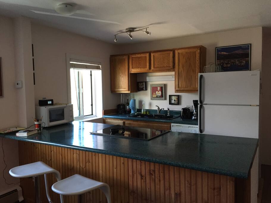 Kitchen with disposal, oven, microwave, dishwasher, coffee maker, blender and toaster