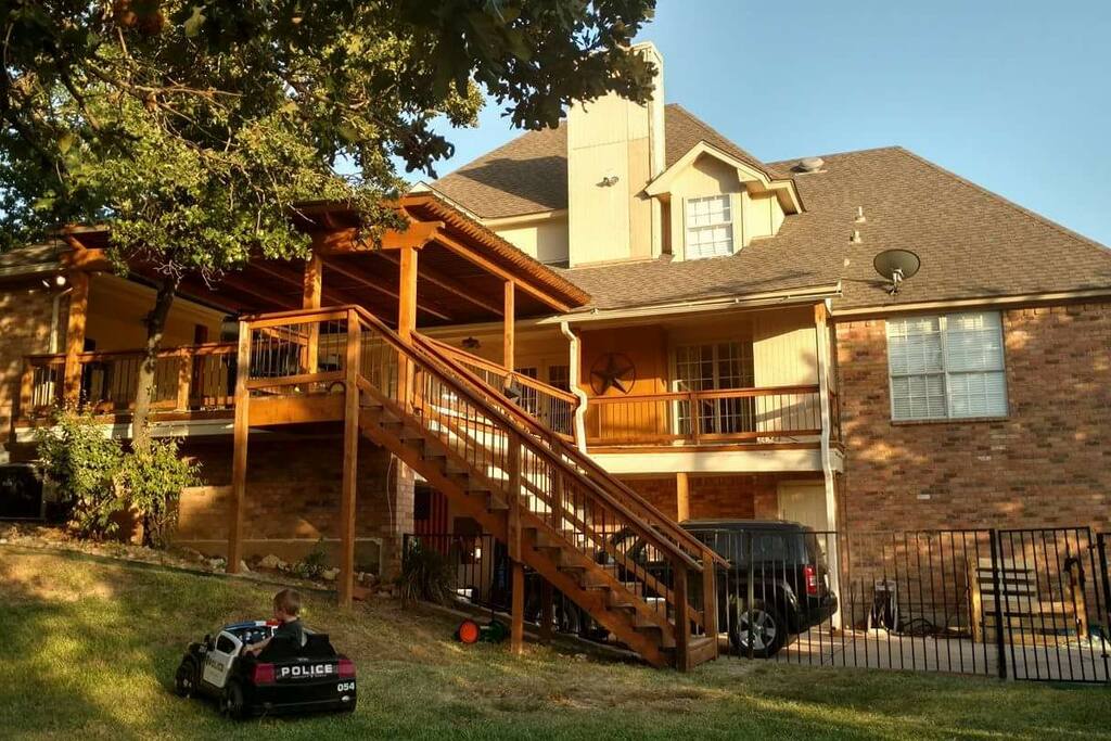 Photo of the house. Entry to apartment is the door on the bottom floor at rear of house.