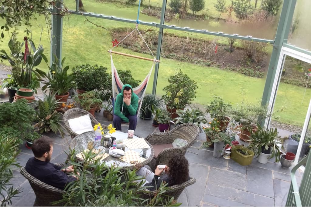 Recent guests enjoying the atrium
(and the squash court and sauna when it rained one day)