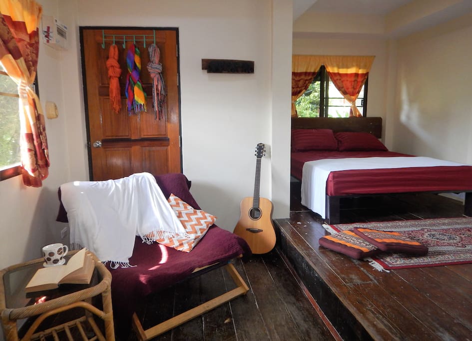 This is a one bedroom bungalow by the beach with a Queen size bed, a relaxing chair for reading, a TV, wifi connection and a very cozy outside area.
