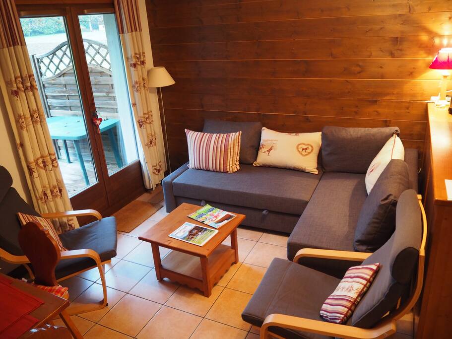 Lounge with patio doors onto decking and open fields