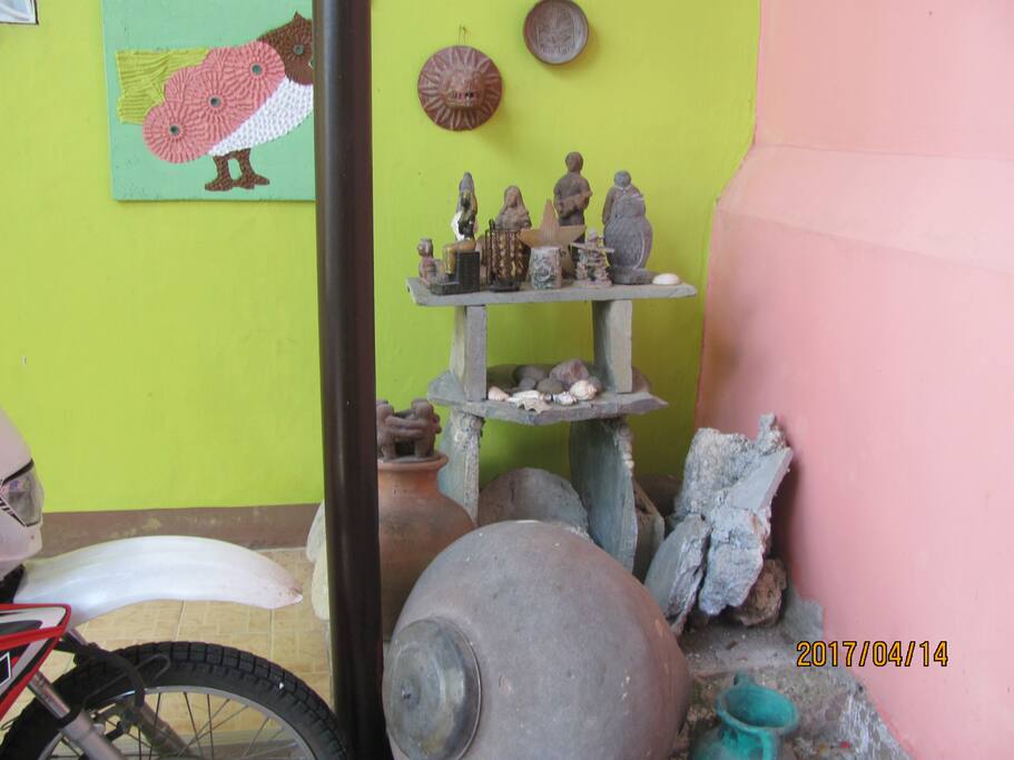 At the corner of room entrance is the pyramid and antiquities rock garden