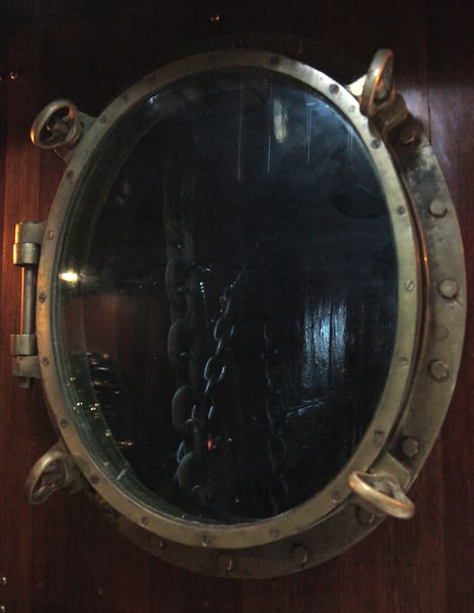 Historic porthole views through to chain locker