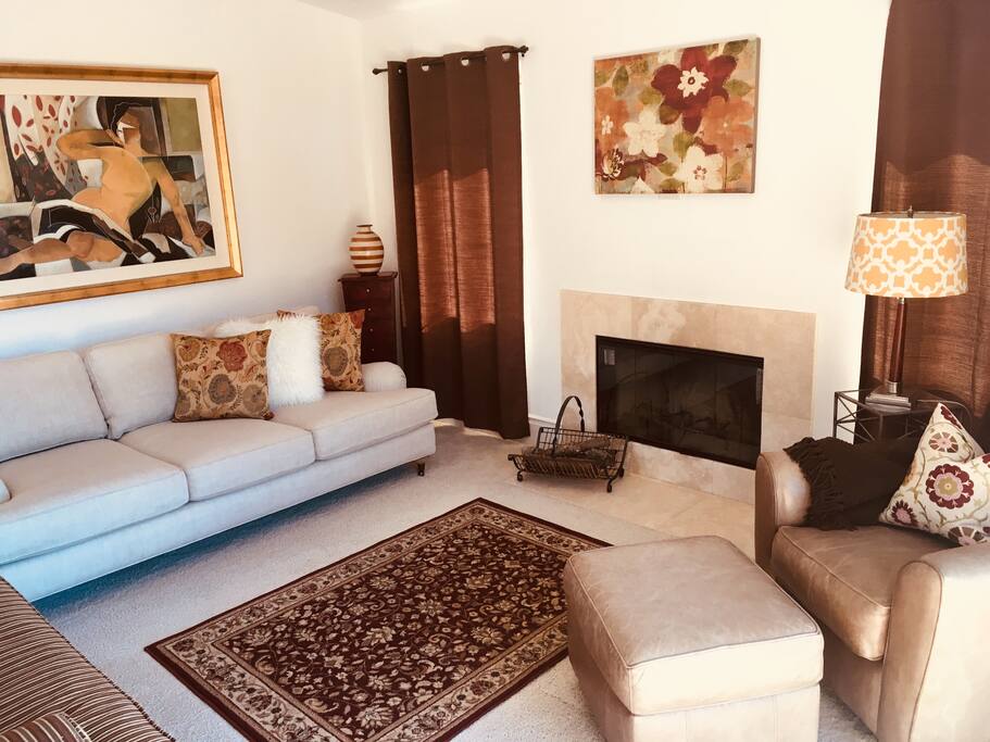 Contemporary family room with fireplace and kitchen nook