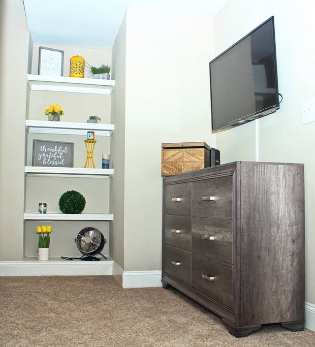 Beautifully accented bedroom with smart tv and live tv functions