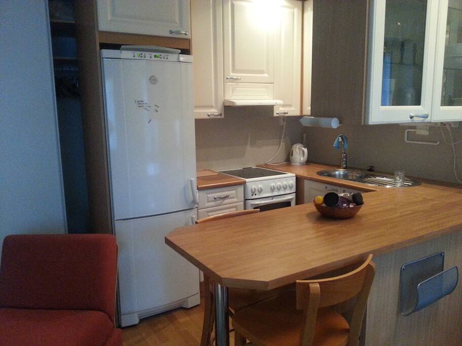The kitchen and a cozy bar table