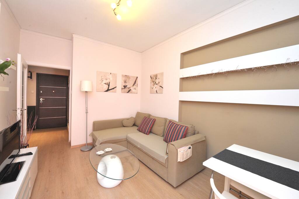 Cosy living room with comfortable corner sofa and flat screen TV!