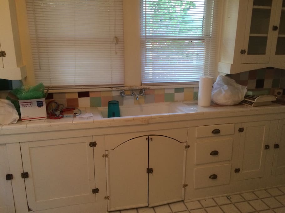 Kitchen with refrigerator, microwave, oven and stovetop