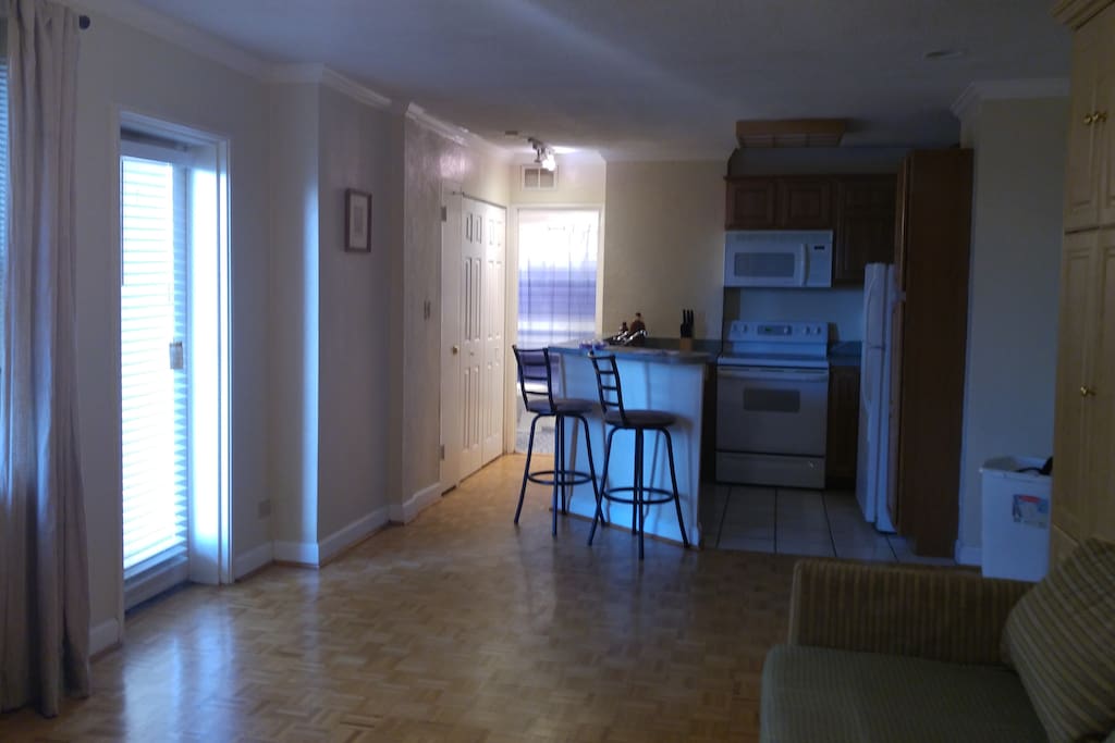 Full Kitchen, Bath and Door to Balcony