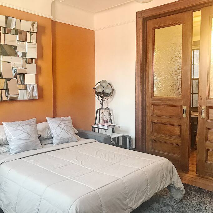 Guest bedroom w/ antique sliding doors.