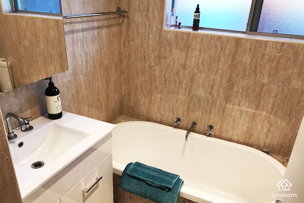 Renovated bathroom with bath tub
