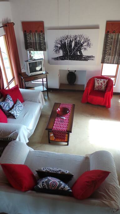 Air conditioned lounge opens to outside dining patio